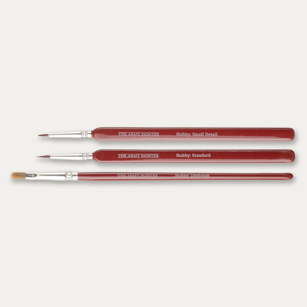 The Army Painter Hobby Starter brush set laid out sideways on a white background.