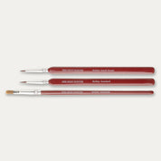 The Army Painter Hobby Starter brush set laid out sideways on a white background.