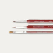 Closeup of the tips of The Army Painter Hobby Starter brush set on a white background.