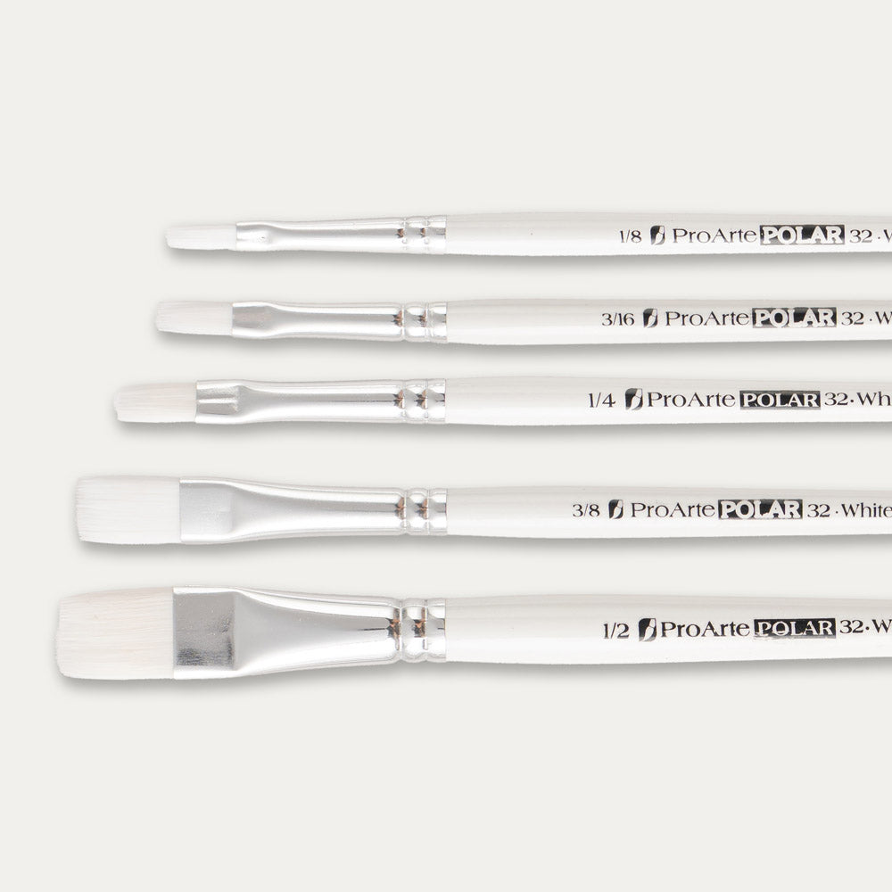 Close-up of the brush tips of the Pro Arte White Nylon flat paint brush set on a white background.