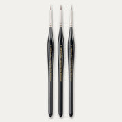 Three size 0 ABC Brushes Easy-Grip Elite Miniature Brushes on a white background.