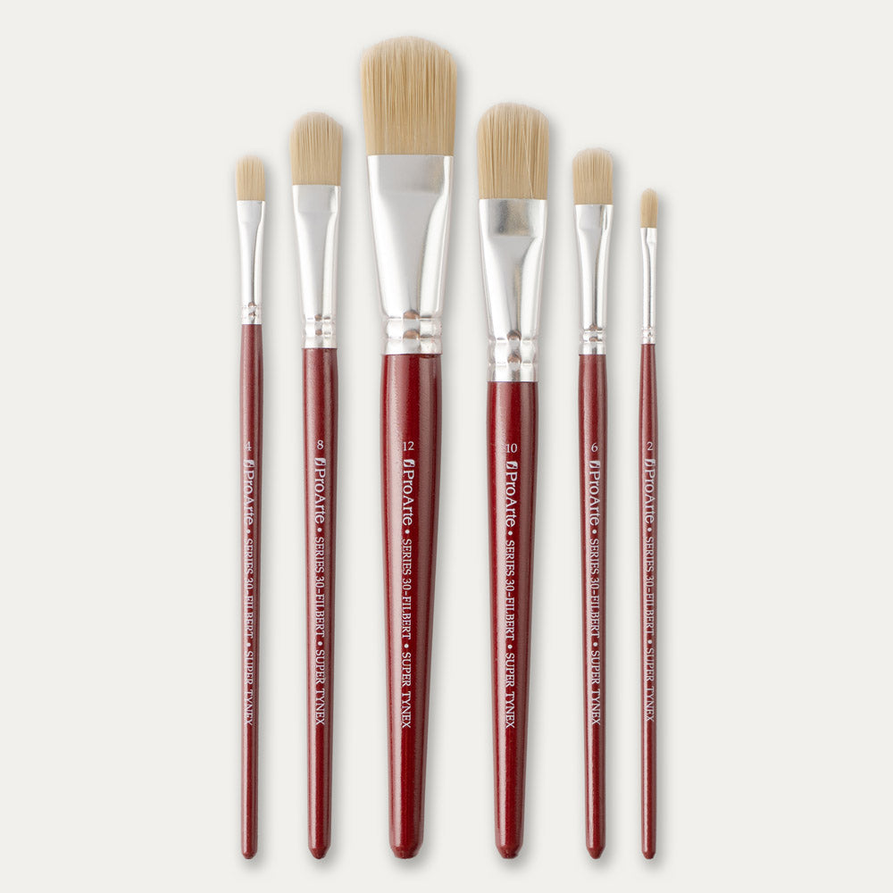 Six Pro Arte Filbert stippler brushes, laid out on a white background.