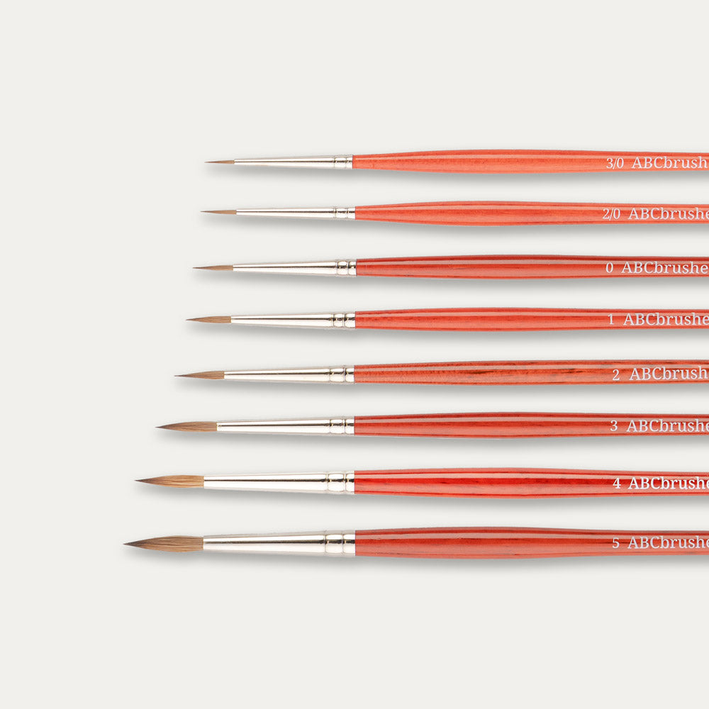 Close-up of the tips of the ABC Brushes Spearhead paint brush set on a white background.