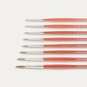 Close-up of the tips of the ABC Brushes Spearhead paint brush set on a white background.