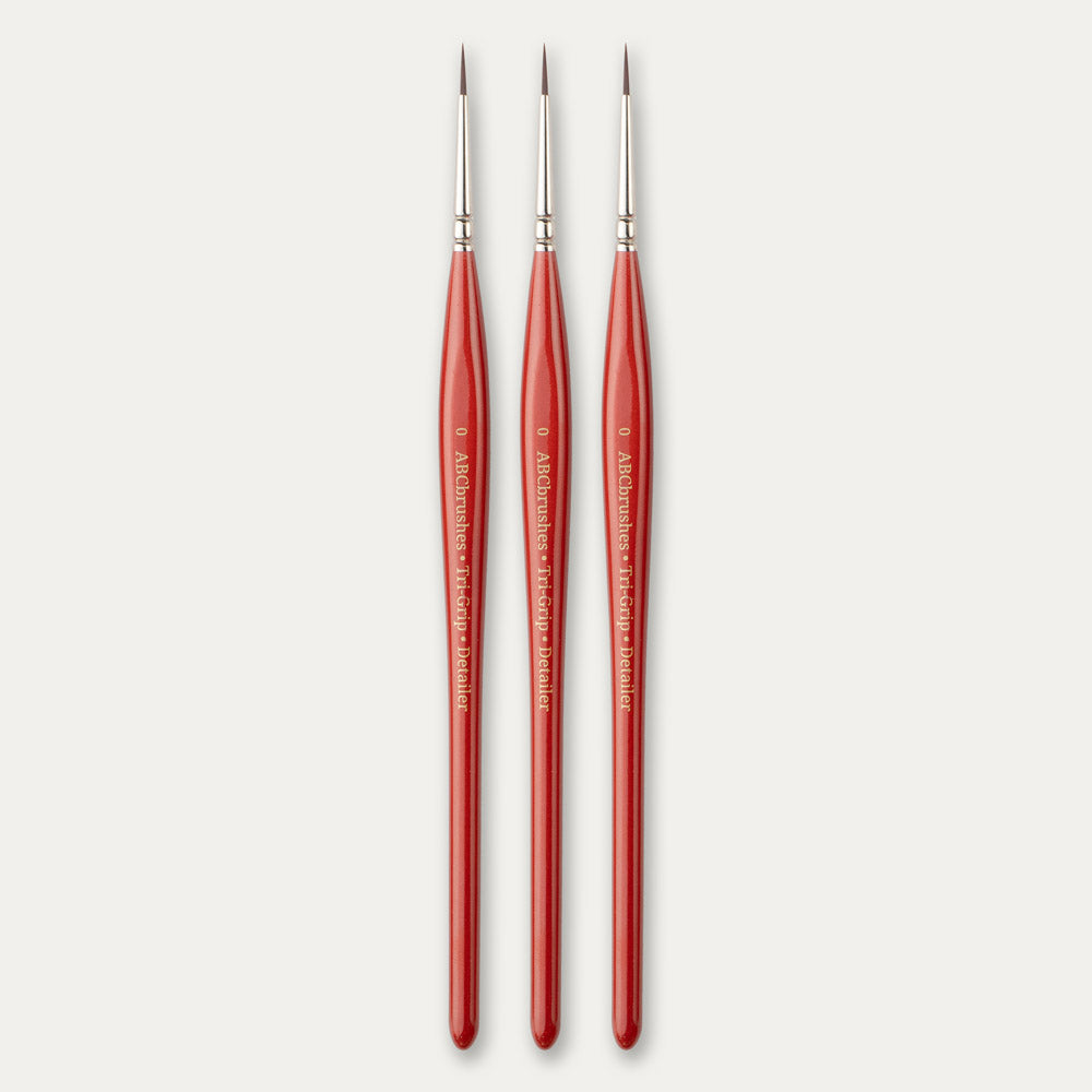 Three size 0 ABC Brushes Tri-Grip Detailer paint brushes on a white background.