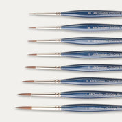 Close-up of the brush tips of the ABC Brushes Tri-Grip Wave Synthetic brush set on a white background. 