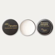 ABCbrushes lid, open product and bottom arranged in a line on a white background.