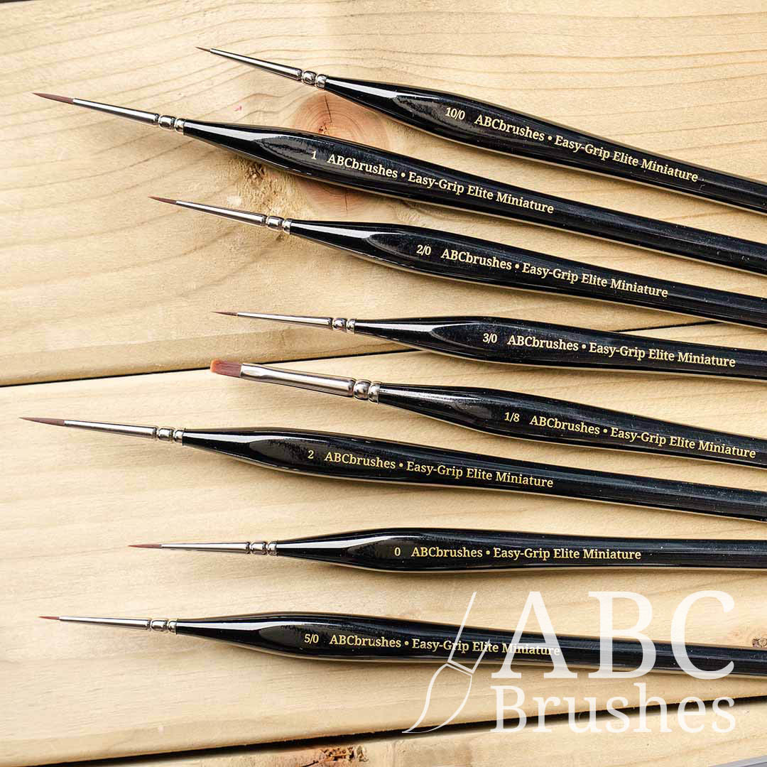 ABC Brushes Easy-Grip Elite Miniature Brush range on a wooden background.