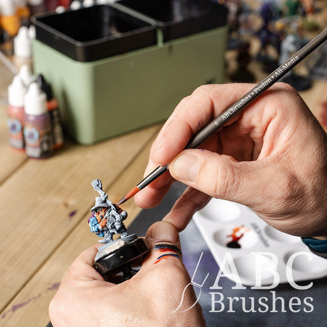 Painting the base coat of a mini figure with a size 6 ABC Brushes Prolon All Media brush.