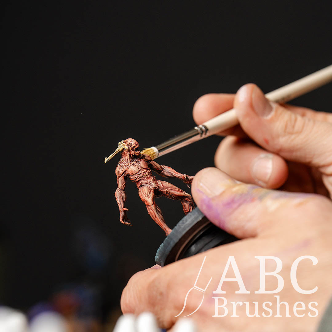 Using ABC Brushes Dry Brush to apply dry brush textures to a red demon miniature.