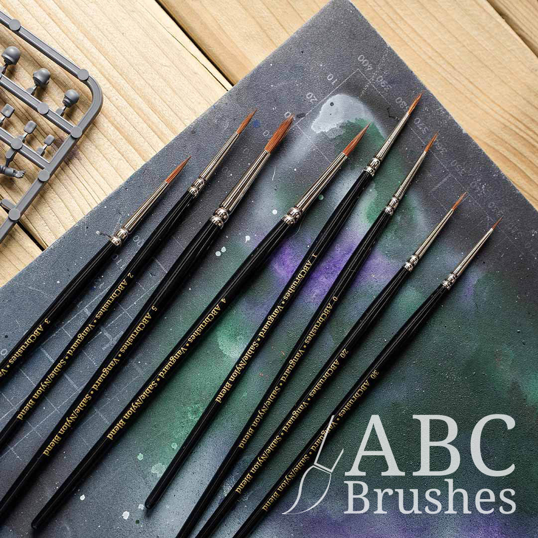 ABC Brushes Vanguard range on a paint covered cutting mat, with a sprue next to them.