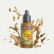 Bottle of the Army Painter Speedpaint in the colour Ancient Honey on a white background. There are splatters of Ancient Honey paint emerging from the bottom of the paint bottle. 
