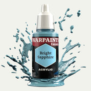 Bottle of the Army Painter Fanatics in the colour Bright Sapphire on a white background. There are splatters of paint emerging from the bottom of the paint bottle. 