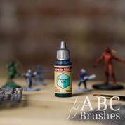 Bottle of the Army Painters Speedpaint in the colour Palsmatic Bolt, with wargaming models and an ABC paintbrush in the background, on a wooden surface.