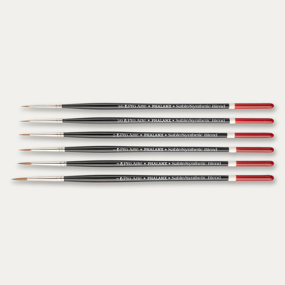 Pro Arte Phalanx round paint brush set laid out sideways on a white background.