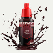 Bottle of the Army Painter Fanatics Wash in the colour Red Tone on a white background. There are splatters of paint emerging from the bottom of the paint bottle. 
