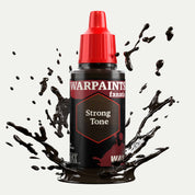 Bottle of the Army Painter Fanatics Wash in the colour Strong Tone on a white background. There are splatters of paint emerging from the bottom of the paint bottle. 