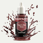 Bottle of the Army Painter Fanatics in the colour Tiger's Eye Skin on a white background. There are splatters of paint emerging from the bottom of the paint bottle. 