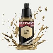 Bottle of the Army Painter Fanatics Metallic paint in the colour True Brass on a white background. There are splatters of paint emerging from the bottom of the paint bottle. 